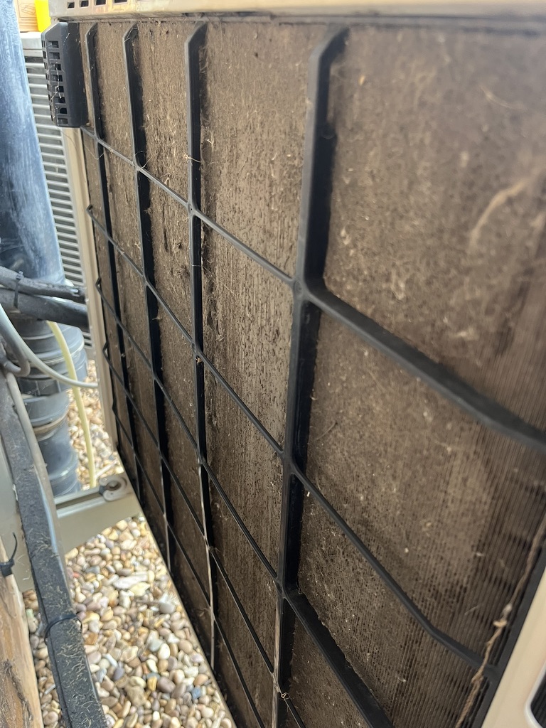 Outdoor air conditioning heat exchanger blocked with dirt
