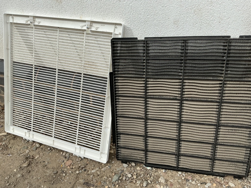 Heavily contaminated air conditioning filters removed for cleaning