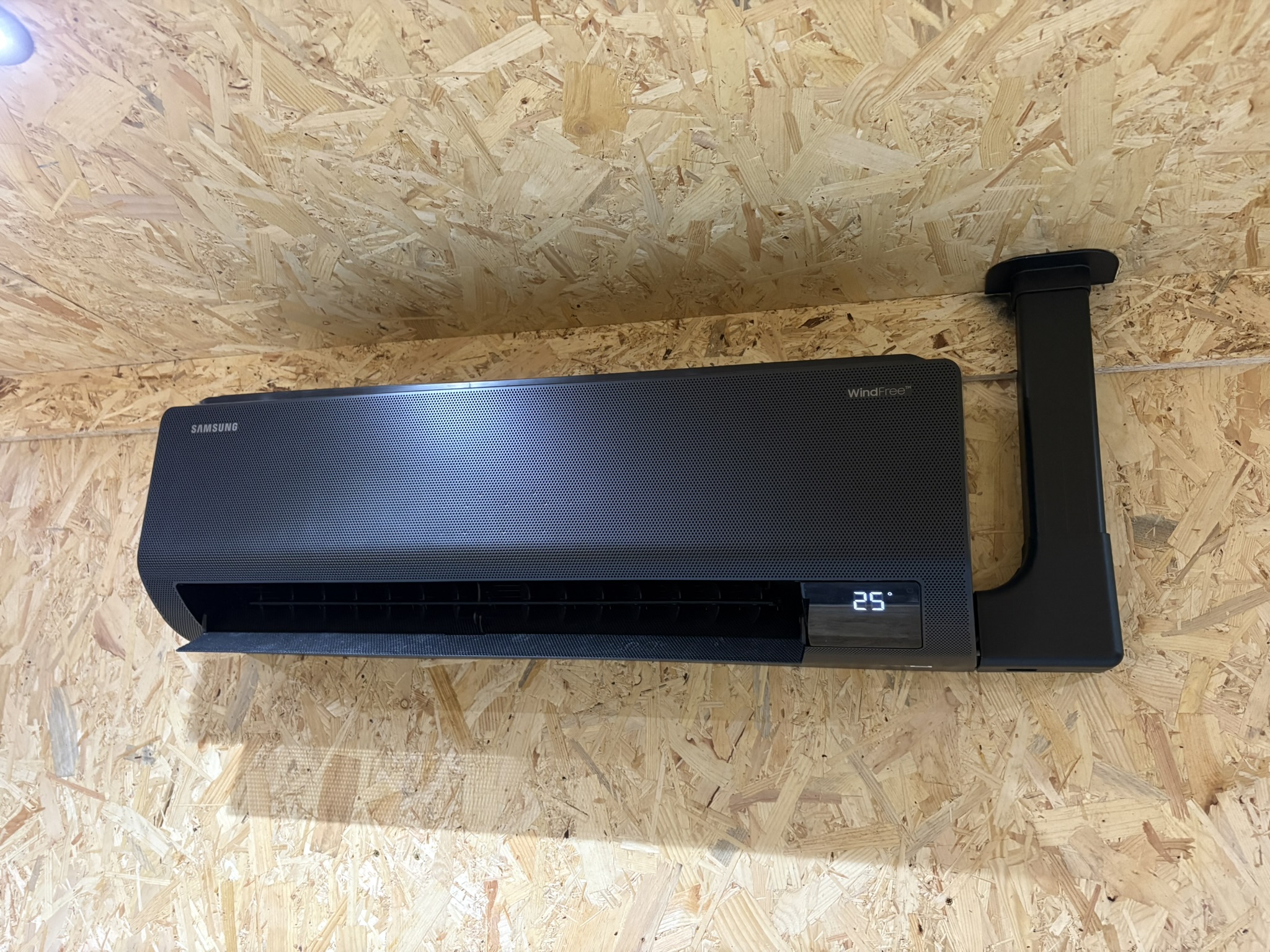 Black Samsung WindFree wall-mounted air conditioning unit at Shredfast reception